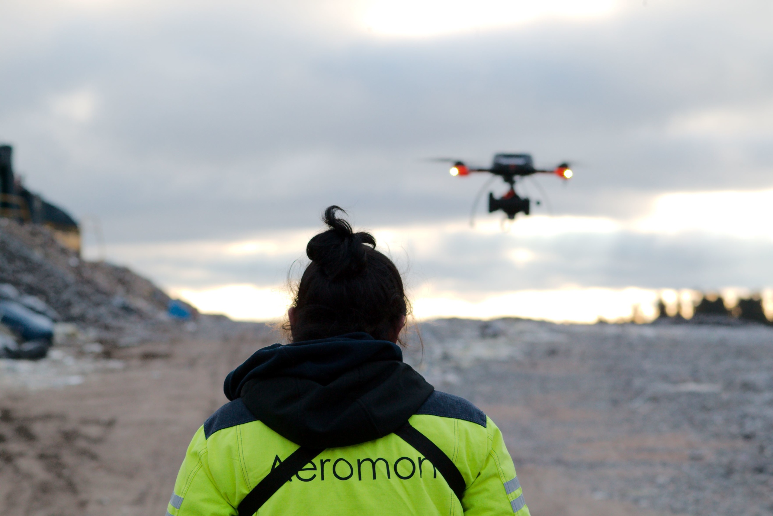 Aeromon field engineer flying a drone.