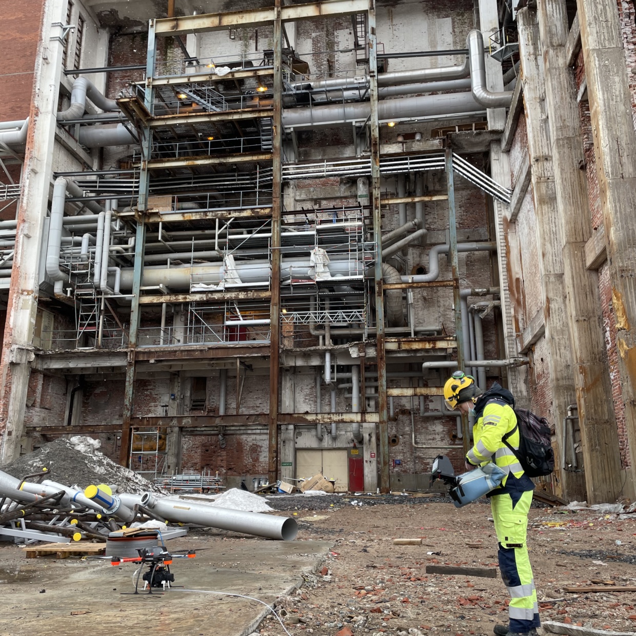 Aeromon field engineer preparing a drone take-off on process site.